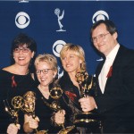 Group photo of Dava Savel, Tracy Newman, Ellen Degeneres, John Stark accepting Emmy Award for The Puppy Episode of Ellen Degeneres Show