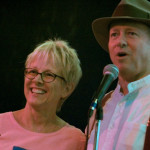 photo of Tracy Newman standing on stage with Dutch Newman