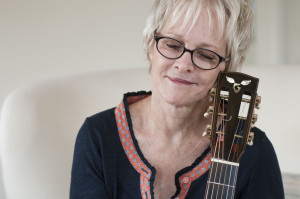 Photo of Tracy Newman and her Goodall guitar - Photo by James F. Dean.